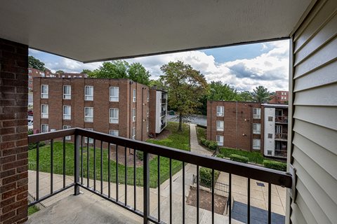 the view from the balcony of an apartment building on a sunny day